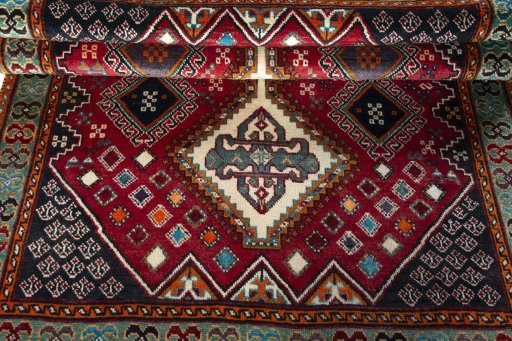 Full view of 2000s Shiraz rug from Iran / Persia, 200 × 139 cm in Red tones
