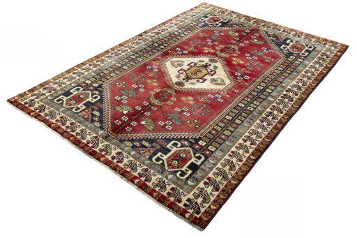 Corner detail of 2000s Shiraz rug showing border pattern and Wool pile
