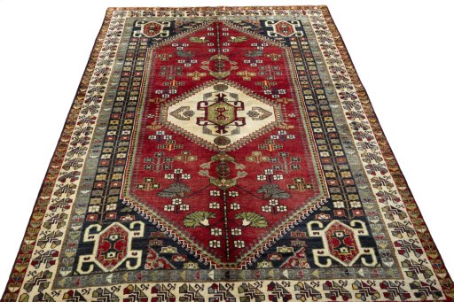 Surface texture of 2000s Shiraz rug with natural Wool and intricate pattern