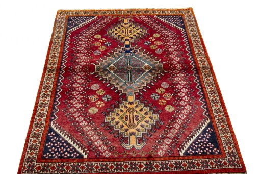 Surface texture of 2000s Shiraz rug with natural Wool and intricate pattern
