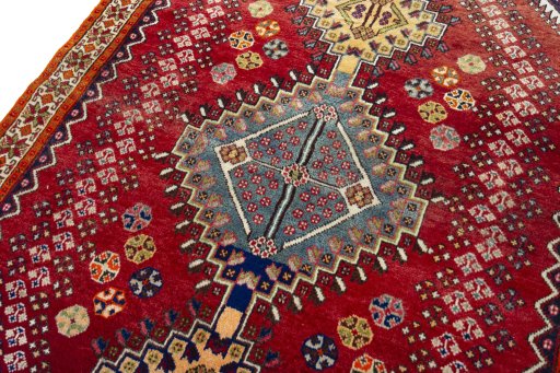 Backside of handmade 2000s Shiraz rug showing knot structure and weave density