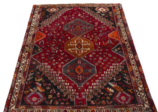 Surface texture of 2000s Shiraz rug with natural Wool and intricate pattern