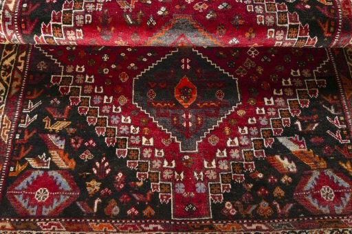 Full view of 2000s Shiraz rug from Iran / Persia, 165 × 120 cm in Red tones