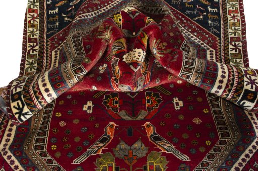 Corner detail of 2000s Shiraz rug showing border pattern and Wool pile