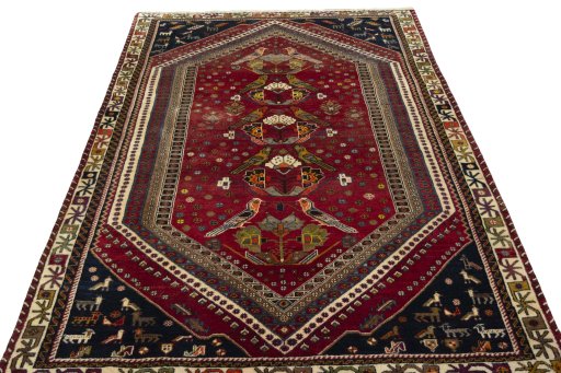 Surface texture of 2000s Shiraz rug with natural Wool and intricate pattern