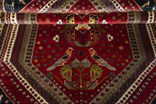 Full view of 2000s Shiraz rug from Iran / Persia, 240 × 153 cm in Red tones