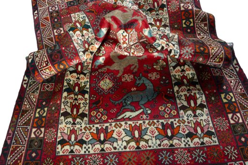 Corner detail of 2000s Shiraz rug showing border pattern and Wool pile