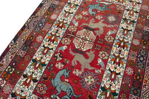 Backside of handmade 2000s Shiraz rug showing knot structure and weave density