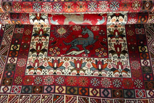 Full view of 2000s Shiraz rug from Iran / Persia, 200 × 128 cm in Red tones