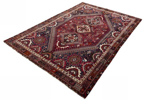Corner detail of 2000s Shiraz rug showing border pattern and Wool pile