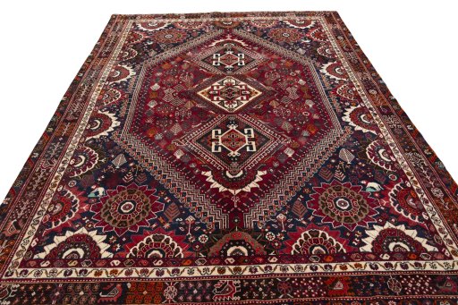 Surface texture of 2000s Shiraz rug with natural Wool and intricate pattern