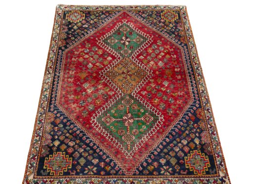 Surface texture of 2000s Shiraz rug with natural Wool and intricate pattern