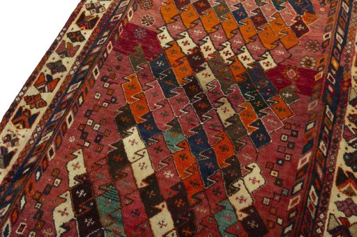 Backside of handmade 2000s Shiraz rug showing knot structure and weave density