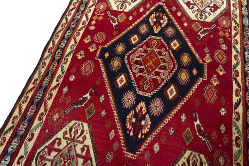 Backside of handmade 2000s Shiraz rug showing knot structure and weave density
