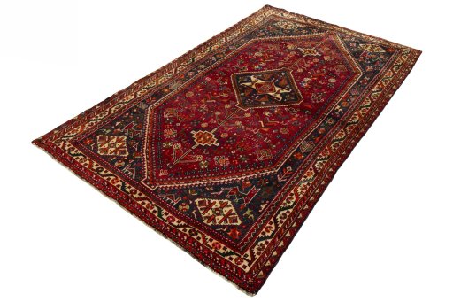 Corner detail of 2000s Shiraz rug showing border pattern and Wool pile