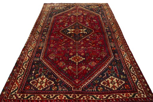 Surface texture of 2000s Shiraz rug with natural Wool and intricate pattern