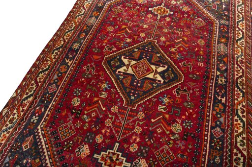 Backside of handmade 2000s Shiraz rug showing knot structure and weave density