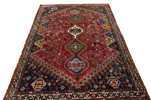 Surface texture of 2000s Shiraz rug with natural Wool and intricate pattern