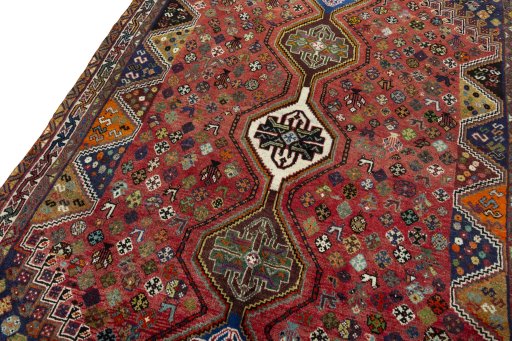 Backside of handmade 2000s Shiraz rug showing knot structure and weave density