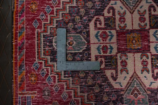 Backside of handmade 2000s Shiraz rug showing knot structure and weave density
