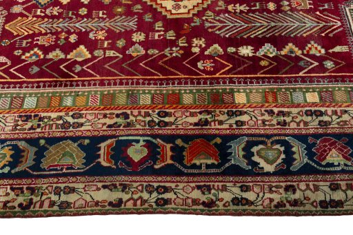 Corner detail of 2000s Shiraz rug showing border pattern and Wool pile