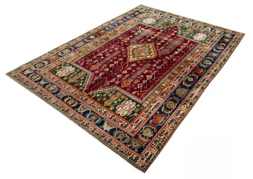 Corner detail of 2000s Shiraz rug showing border pattern and Wool pile