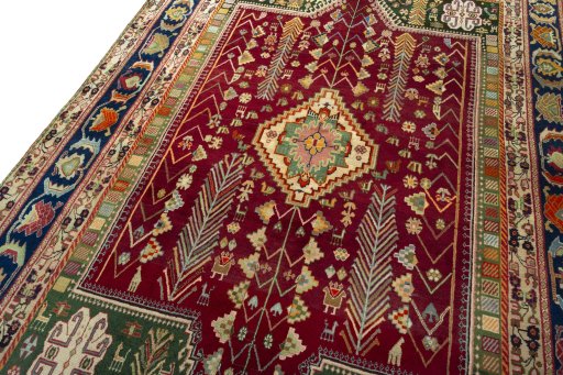 Backside of handmade 2000s Shiraz rug showing knot structure and weave density