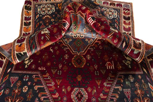 Surface texture of 2000s Shiraz rug with natural Wool and intricate pattern