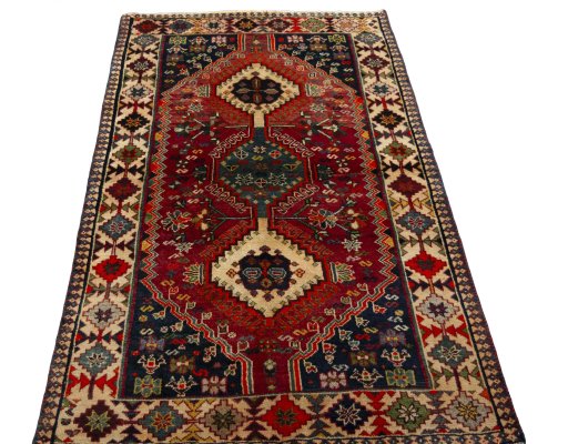 Surface texture of 2000s Shiraz rug with natural Wool and intricate pattern