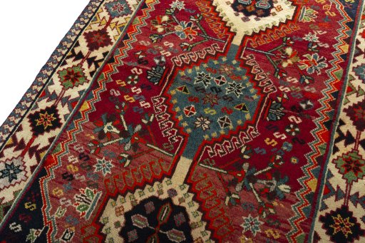 Backside of handmade 2000s Shiraz rug showing knot structure and weave density