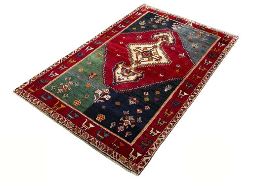 Corner detail of 2000s Shiraz rug showing border pattern and Wool pile
