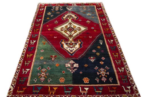 Surface texture of 2000s Shiraz rug with natural Wool and intricate pattern
