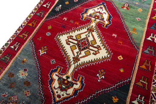 Backside of handmade 2000s Shiraz rug showing knot structure and weave density
