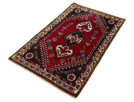 Corner detail of 2000s Shiraz rug showing border pattern and Wool pile