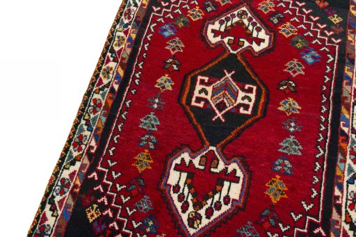 Backside of handmade 2000s Shiraz rug showing knot structure and weave density