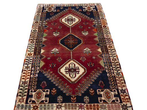 Surface texture of 2000s Shiraz rug with natural Wool and intricate pattern