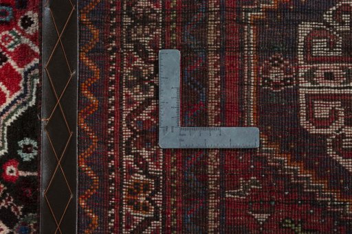Surface texture of 2000s Shiraz rug with natural Wool and intricate pattern