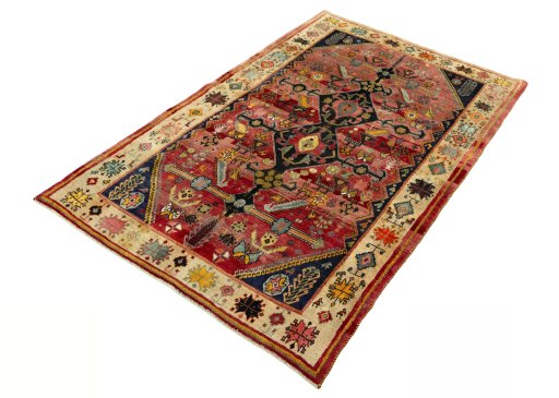 Corner detail of 2000s Shiraz rug showing border pattern and Wool pile