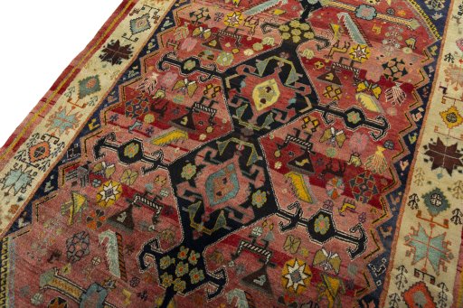 Backside of handmade 2000s Shiraz rug showing knot structure and weave density
