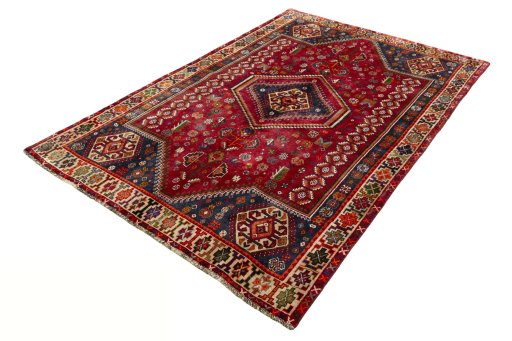 Corner detail of 2000s Shiraz rug showing border pattern and Wool pile