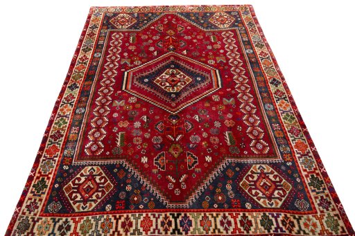 Surface texture of 2000s Shiraz rug with natural Wool and intricate pattern