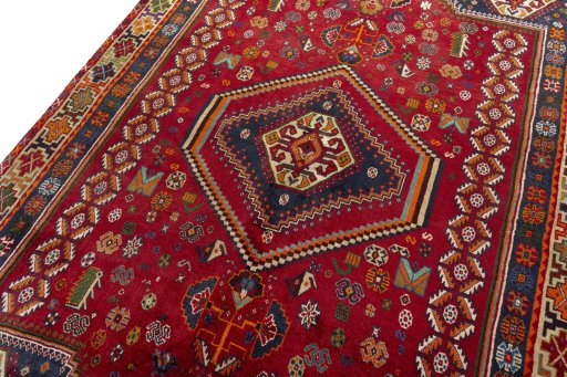 Backside of handmade 2000s Shiraz rug showing knot structure and weave density