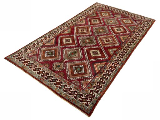 Corner detail of 2000s Shiraz rug showing border pattern and Wool pile