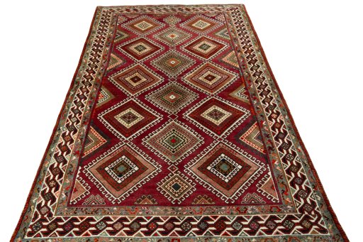 Surface texture of 2000s Shiraz rug with natural Wool and intricate pattern