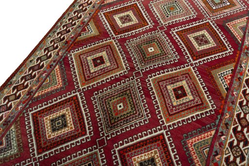 Backside of handmade 2000s Shiraz rug showing knot structure and weave density