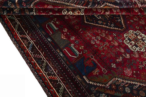Corner detail of 1970s Shiraz rug showing border pattern and Wool pile