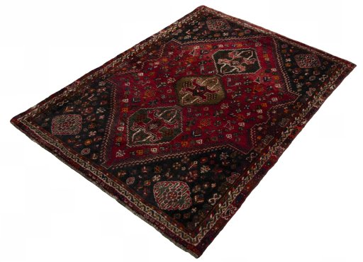 Corner detail of 2000s Shiraz rug showing border pattern and Wool pile