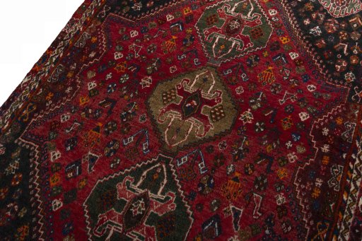 Backside of handmade 2000s Shiraz rug showing knot structure and weave density