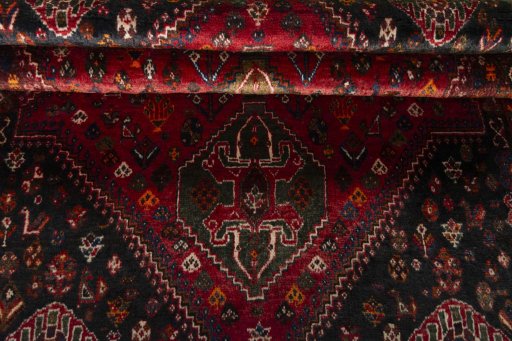 Full view of 2000s Shiraz rug from Iran / Persia, 167 × 116 cm in Red tones