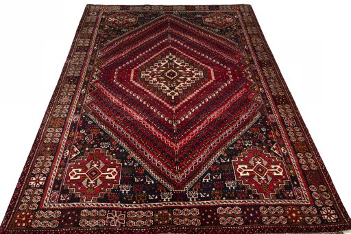 Surface texture of 2000s Shiraz rug with natural Wool and intricate pattern